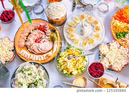 Easter breakfast with traditional holiday dishes and Easter cake. Easter breakfast with traditional holiday dishes and Easter cake. 125105660