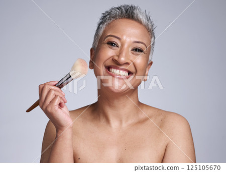 Beauty, makeup and brush with senior woman for product, luxury and cosmetics. Foundation, blush and salon with portrait of mature model and smile for product self care, wellness and cosmetology 125105670
