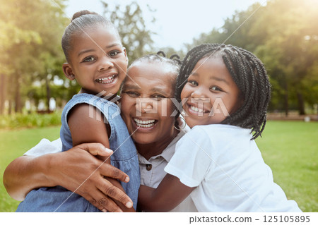 Park, black family and portrait of children with grandmother bonding, smiling and having fun. Summer, love and grandma embrace and hug girls for quality time on weekend, holiday and vacation outdoors Park, black family and portrait of children with grandmother bonding, smiling and having fun. Summer, love and grandma embrace and hug girls for quality time on weekend, holiday and vacation outdoors 125105895