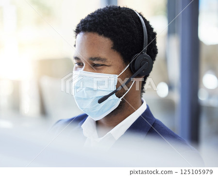 Covid, black man and call center for customer communication with mask for professional consultation. Virus, safety and telemarketing expert consulting in office with face mask in corona pandemic. Covid, black man and call center for customer communication with mask for professional consultation. Virus, safety and telemarketing expert consulting in office with face mask in corona pandemic. 125105979