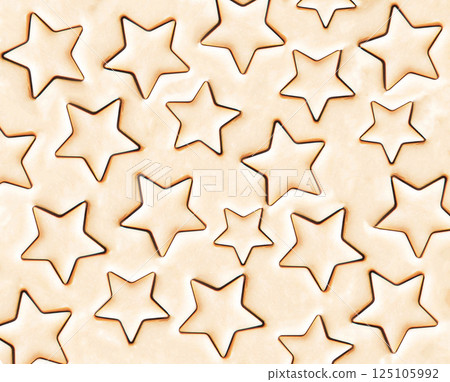 Cookie dough background with cut out stars. Sweet background. Sugar cookie dough 125105992