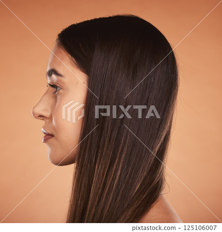 Hair, beauty and woman face for healthy hairstyle and hair care on a brown studio background. Hair style, haircare and cosmetic treatment for shiny, healthy hair in a salon with a headshot profile 125106007
