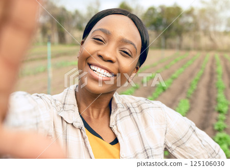 Agriculture, farm and selfie of happy black woman smiling and taking picture outdoors. Agro, sustainability and self portrait of female farmer for social media or internet post after checking plants. Agriculture, farm and selfie of happy black woman smiling and taking picture outdoors. Agro, sustainability and self portrait of female farmer for social media or internet post after checking plants. 125106030