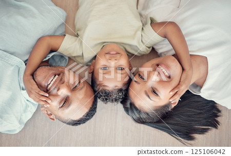 Top view, family and boy bonding on floor in house living room or home bedroom for mothers day, fathers day or love. Portrait, smile and happy man, woman and child in trust, security and love support 125106042