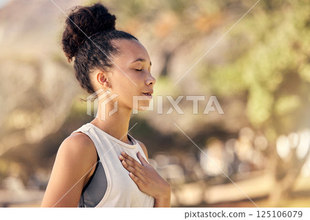 Black woman, breath and hand on chest, for meditation and wellness being peaceful to relax. Bokeh, African American female and lady outdoor, in nature and being calm for breathing exercise and health Black woman, breath and hand on chest, for meditation and wellness being peaceful to relax. Bokeh, African American female and lady outdoor, in nature and being calm for breathing exercise and health 125106079