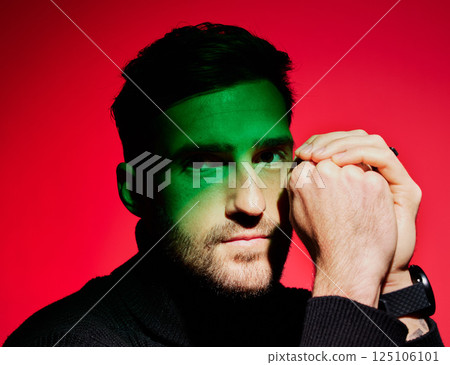 Man model, green light and fashion for beauty, creative and luxury designer aesthetic portrait. Fashion model with cosmetic skincare, wellness and face with color, art and cool shadow lighting Man model, green light and fashion for beauty, creative and luxury designer aesthetic portrait. Fashion model with cosmetic skincare, wellness and face with color, art and cool shadow lighting 125106101