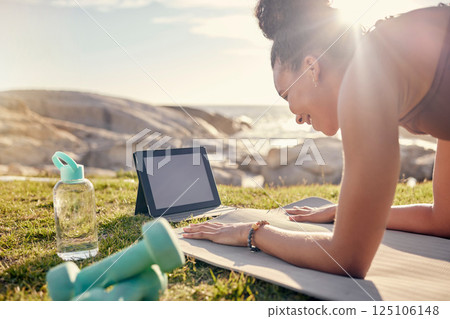 Yoga, nature and tablet with woman on fitness online class, live streaming or video learning mockup in summer. Pilates, stretching and workout sports girl in a park with exercise gear and tech screen Yoga, nature and tablet with woman on fitness online class, live streaming or video learning mockup in summer. Pilates, stretching and workout sports girl in a park with exercise gear and tech screen 125106148