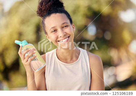 Water bottle, fitness and nature of black woman in portrait for outdoor exercise, wellness and healthy diet lifestyle in park or forest. Trees bokeh, workout and sports girl with drinking water gear 125106189