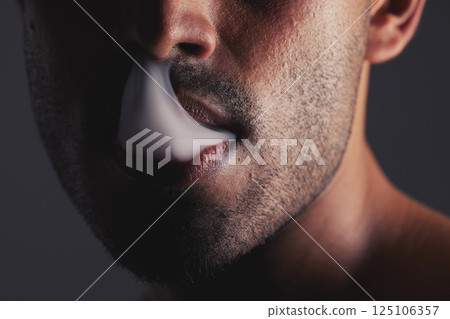 Smoke, black man and face marijuana with cancer awareness and with bad habit with black studio background. Addiction, mouth with smoking cloud and male with drug puff with weed, vape and cigarette. 125106357