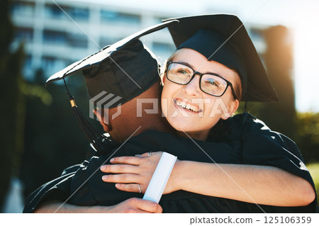 Hug, graduation and student achievement, happy or smile for success outdoor in gown. Graduate, academic or embrace for diploma, happiness or certificate completed at university, college and education 125106359