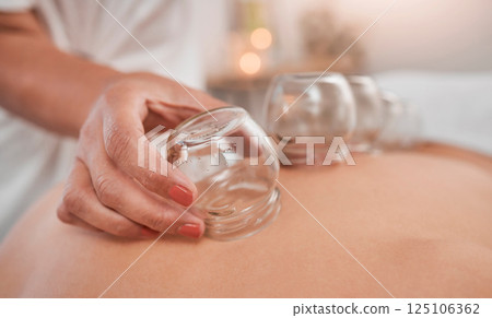 Relax, health and cupping therapy with woman in spa for alternative medicine, healthcare and healing. Peace, skincare or luxury with patient and hands of massage therapist for beauty, zen or holistic Relax, health and cupping therapy with woman in spa for alternative medicine, healthcare and healing. Peace, skincare or luxury with patient and hands of massage therapist for beauty, zen or holistic 125106362