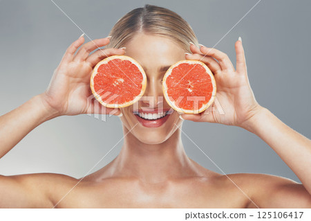 Woman, beauty and product with grapefruit skincare for healthy skin, self care and natural cosmetics glow. Facial citrus moisturizer, happy face and moisturizing vitamin c organic cosmetology routine 125106417