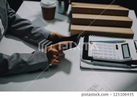 Portrait of Asian young female working on laptop at office 125106435