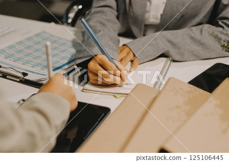 Portrait of Asian young female working on laptop at office 125106445
