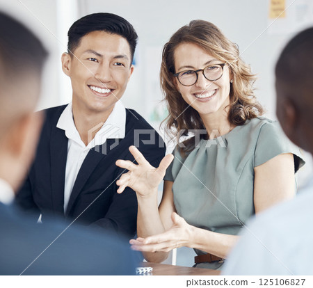 Marketing, planning and business people in a meeting, discussion and corporate collaboration at work. Diversity, teamwork and employees explaining a strategy with a smile while working together 125106827