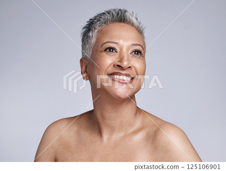 Senior model, beauty and smile on face for makeup, cosmetics and skincare with vision in studio. Elderly black woman, cosmetic wellness and happy for skin glow, radiant and health by grey background Senior model, beauty and smile on face for makeup, cosmetics and skincare with vision in studio. Elderly black woman, cosmetic wellness and happy for skin glow, radiant and health by grey background 125106901