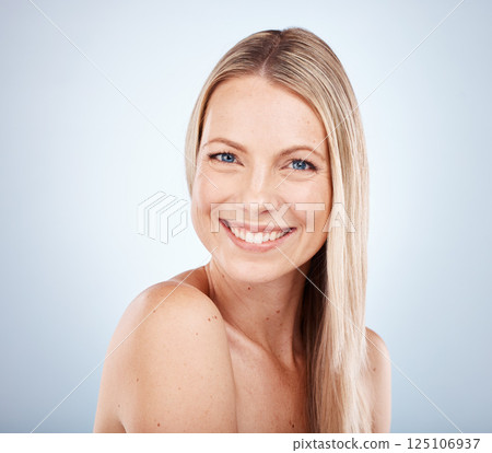 Beauty, portrait and face of a woman for skincare, health and wellness against a grey studio background. Front cosmotology and skin care or bodycare for a female with soft, smooth skin 125106937