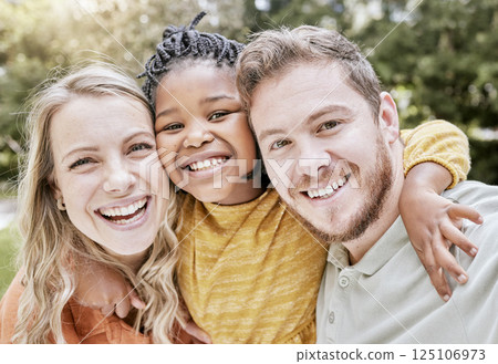 Happy, interracial family and smile portrait of a mother, girl and father with bonding in nature. Diversity, love and adoption care of a mom, kid and man hug together with youth happiness outdoor 125106973