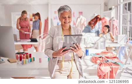 Digital tablet, ecommerce and elderly business woman checking sales, profit and inventory for small business startup. Happy, business owner and fashion designer managing online orders for design 125106995