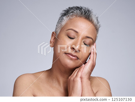 Beauty, elderly woman and skincare cosmetics for face anti aging wrinkle product for natural glow, healthy and organic treatment. Black senior, facial skin health and a peaceful spa routine to relax Beauty, elderly woman and skincare cosmetics for face anti aging wrinkle product for natural glow, healthy and organic treatment. Black senior, facial skin health and a peaceful spa routine to relax 125107130