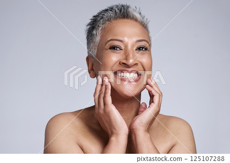 Face, hands and beauty with antiaging and woman, smile in portrait for skincare with studio background. Facial, treatment and face care mockup with natural cosmetics and happy mature model in makeup. 125107288