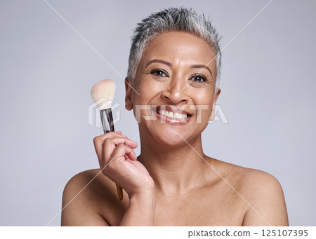 Beauty, makeup and brush with senior woman for wellness, product and salon cosmetics. Foundation, self care and luxury with smile portrait of face of mature model for health, cosmetology and skincare Beauty, makeup and brush with senior woman for wellness, product and salon cosmetics. Foundation, self care and luxury with smile portrait of face of mature model for health, cosmetology and skincare 125107395