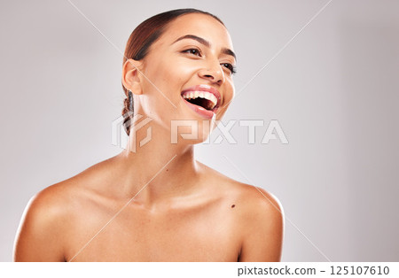 Skincare, face glow or laughing woman on studio background in self love, dermatology wellness or cosmetology success. Smile, happy or Brazilian beauty model and facial makeup cosmetics on gray mockup Skincare, face glow or laughing woman on studio background in self love, dermatology wellness or cosmetology success. Smile, happy or Brazilian beauty model and facial makeup cosmetics on gray mockup 125107610