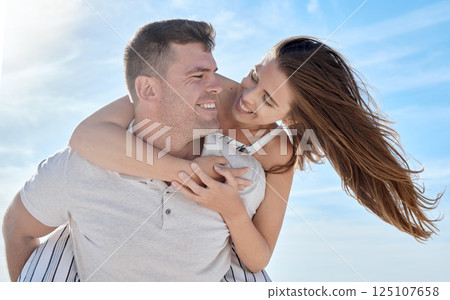 Love, blue sky and bonding couple hug while on honeymoon vacation date for romance, quality time or outdoor freedom. Peace, trust partnership and fun marriage people play piggyback in Toronto Canada Love, blue sky and bonding couple hug while on honeymoon vacation date for romance, quality time or outdoor freedom. Peace, trust partnership and fun marriage people play piggyback in Toronto Canada 125107658