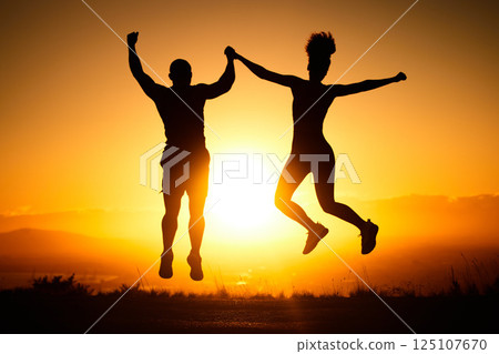 Sunset, jump and view with a sports couple outdoor in nature for a workout, fitness or exercise together. Silhouette, motivation and health with a man and woman jumping in celebration of a goal 125107670