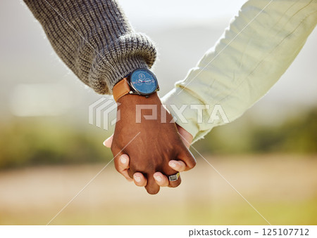 Love, trust and couple holding hands in nature for spring, support and happy in park together. Unity, summer and hope with hands of man and woman in countryside park for partnership, health and time 125107712