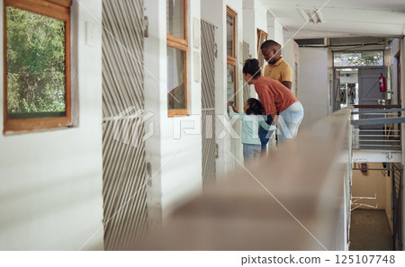 Animal shelter, family and parents bonding with their child while doing community service together. Mother, father and kid looking through a window while volunteering at a pet center or adoption home Animal shelter, family and parents bonding with their child while doing community service together. Mother, father and kid looking through a window while volunteering at a pet center or adoption home 125107748