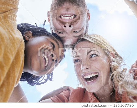 Happy, smile and interracial family hug of mother, father and girl faces outdoor with love and care. Happiness, laughing and summer fun huddle of a mom, dad and kid with below blue sky view Happy, smile and interracial family hug of mother, father and girl faces outdoor with love and care. Happiness, laughing and summer fun huddle of a mom, dad and kid with below blue sky view 125107780