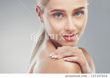 Skincare, beauty and woman in a studio portrait with blue eyes for cosmetics, aesthetic and facial glow advertising or marketing mock up. Young facial, skin care model in natural makeup for self love 125107828