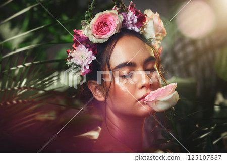 Beauty, skincare and flower with natural fragrance, flower and luxury wellness from nature with green forest background. Woman model with plant advertising cosmetic skin product with a flowers plant 125107887