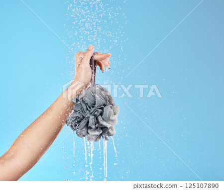 Shower, water and hands with a loofah for luxury wellness, cleaning and grooming against blue studio background. Health, cosmetic and woman with product for body care and treatment with mockup space Shower, water and hands with a loofah for luxury wellness, cleaning and grooming against blue studio background. Health, cosmetic and woman with product for body care and treatment with mockup space 125107890