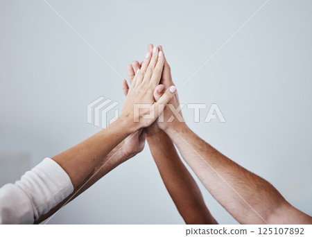 High five, team and hands of people in celebration for teamwork achievement, team building meeting or collaboration. Group solidarity, support and community friends celebrate charity mission success High five, team and hands of people in celebration for teamwork achievement, team building meeting or collaboration. Group solidarity, support and community friends celebrate charity mission success 125107892