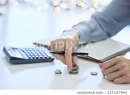 Budget, coin and business hands with calculator for inflation, savings and commerce financial planning. Money, cash and change for finance management, poverty and debt of bank balance or loan payment Budget, coin and business hands with calculator for inflation, savings and commerce financial planning. Money, cash and change for finance management, poverty and debt of bank balance or loan payment 125107944