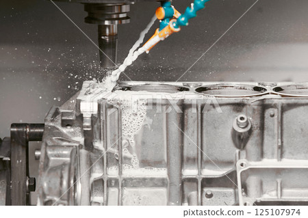 High precision cnc milling machine makes holes in the car engine. High precision cnc milling machine makes holes in the car engine. 125107974
