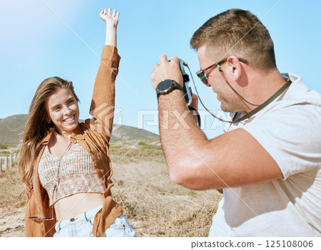 Camera photographer, couple and nature vacation, holiday or summer trip. Love, travel and happy man taking pictures of woman, partner or lover, having fun or enjoying quality time together outdoors. 125108006