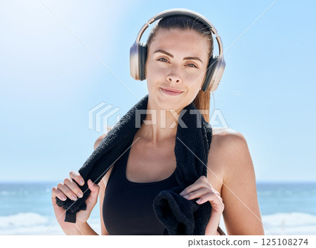 Fitness, music and portrait of woman at the beach for training, workout and health. Relax, radio and towel with girl and headphones after exercise for energy, sports and goals in the morning by sea Fitness, music and portrait of woman at the beach for training, workout and health. Relax, radio and towel with girl and headphones after exercise for energy, sports and goals in the morning by sea 125108274