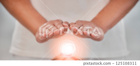 Hands, light energy and chakra healing for spa healthcare and luxury wellness. Woman palm, reiki therapy and spiritual aura expert or healthy power balance for calm lifestyle with body wellbeing 125108311