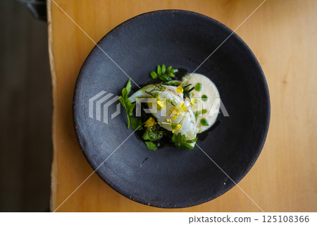 Spring appetizer of fish and wild vegetables 125108366