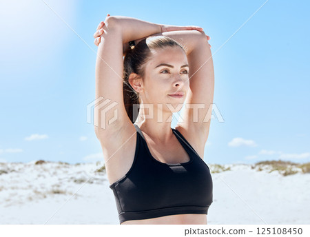 Beach, workout and arm stretching of a woman training in nature before running or yoga. Fitness, healthy and runner person outdoor relax in the sun after outdoor exercise, sport and wellness activity Beach, workout and arm stretching of a woman training in nature before running or yoga. Fitness, healthy and runner person outdoor relax in the sun after outdoor exercise, sport and wellness activity 125108450