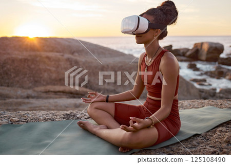Woman, metaverse or vr headset in yoga meditation by beach, ocean waves, sea water in mental health support, zen app or 3d peace ai. Lotus, relax or wellness person on virtual reality chakra software Woman, metaverse or vr headset in yoga meditation by beach, ocean waves, sea water in mental health support, zen app or 3d peace ai. Lotus, relax or wellness person on virtual reality chakra software 125108490
