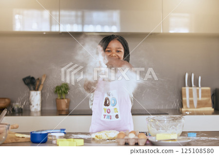 Education, learning and portrait of black girl cooking in kitchen and having fun. Development, baking and happy kid chef playing with flour, preparing egg and delicious food recipes alone in house. 125108580