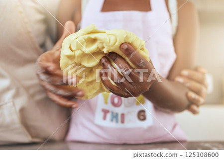 Child, hands and dough with mother in kitchen for learning, cooking or baking in home together. Closeup, cooking and girl with mom, baker and teaching preparation of cake, cookie or biscuit in house 125108600