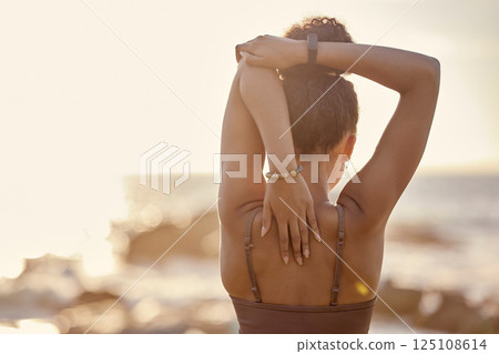 Black woman, stretching and back at beach, for training and exercise for wellness, health and fitness. Bokeh, African American girl and healthy female doing workout, healthy and flexibility in summer Black woman, stretching and back at beach, for training and exercise for wellness, health and fitness. Bokeh, African American girl and healthy female doing workout, healthy and flexibility in summer 125108614