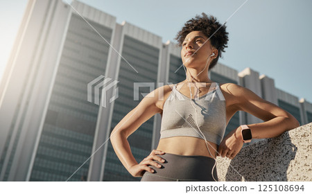 Fitness, music and city black woman thinking of training, running or workout goals, motivation and wellness with 5g technology. Focus runner with sports electronics listening to audio for exercise 125108694