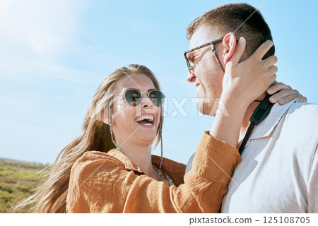 Couple, travel and hug on a vacation adventure laughing on a walk outdoor in summer. Sunglasses, smile and love of a happy couple together with a funny, happiness and fun time in nature walking Couple, travel and hug on a vacation adventure laughing on a walk outdoor in summer. Sunglasses, smile and love of a happy couple together with a funny, happiness and fun time in nature walking 125108705