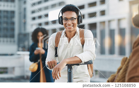 Music, electric scooter and city with a black man on his commute to work or business in the morning. Portrait, headphones and transport with a male employee commuting or working in an urban town Music, electric scooter and city with a black man on his commute to work or business in the morning. Portrait, headphones and transport with a male employee commuting or working in an urban town 125108850